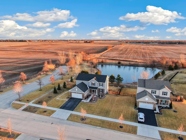 bird's eye view with a rural view and a water view