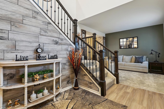 stairway featuring wood finished floors