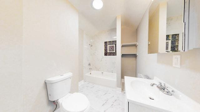 bathroom featuring toilet, marble finish floor, shower / tub combination, and vanity