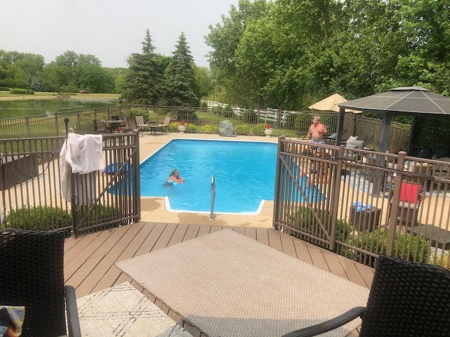 view of pool featuring a patio area, fence, and a fenced in pool