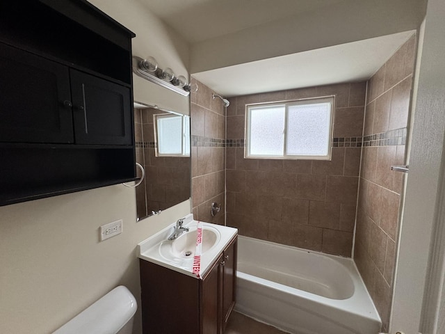 full bathroom featuring vanity, shower / tub combination, and toilet