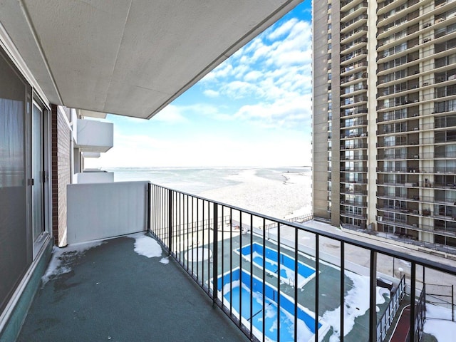 balcony featuring a water view