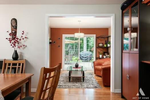 interior space featuring wood finished floors and an inviting chandelier