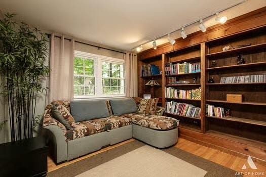 sitting room featuring wood finished floors