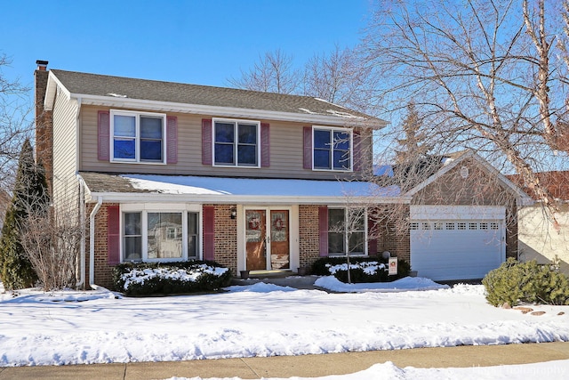 traditional-style house featuring brick siding, a chimney, and an attached garage