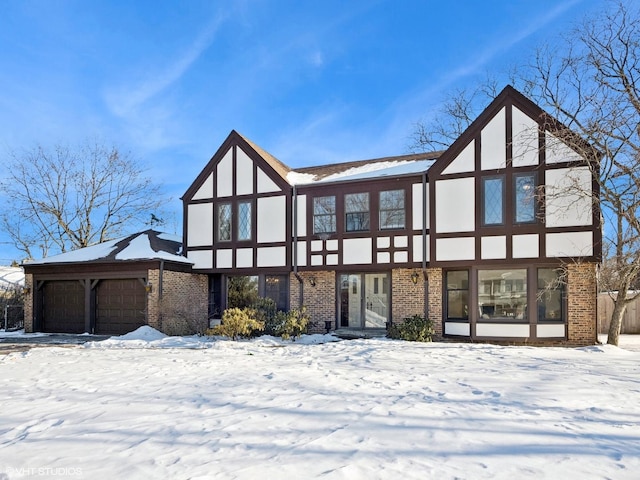 view of front facade with an attached garage and brick siding