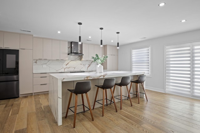 kitchen featuring wall chimney range hood, smart refrigerator, light wood-style floors, and decorative backsplash