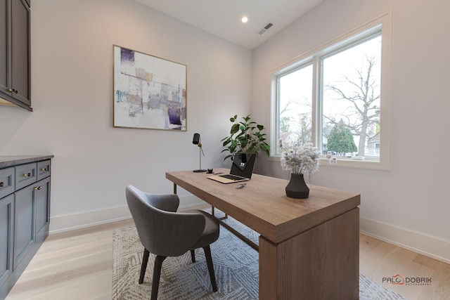 office area with light wood-style flooring, recessed lighting, baseboards, and visible vents