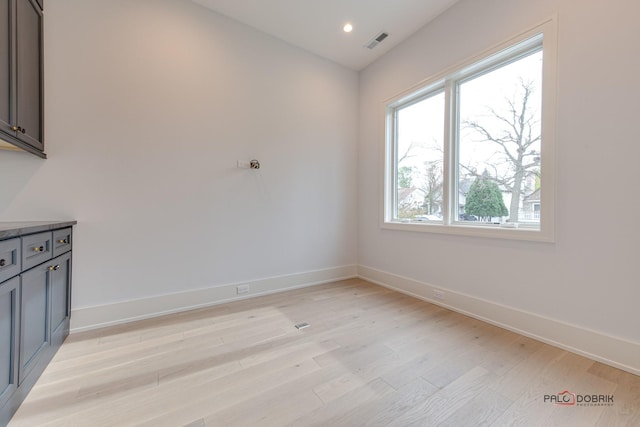 unfurnished room with light wood-style floors, recessed lighting, baseboards, and visible vents