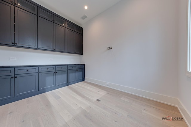 interior space featuring recessed lighting, baseboards, visible vents, and light wood finished floors