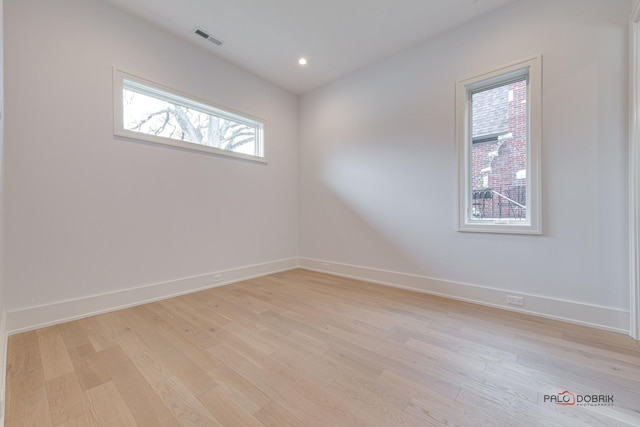 empty room with recessed lighting, visible vents, baseboards, and light wood-style flooring