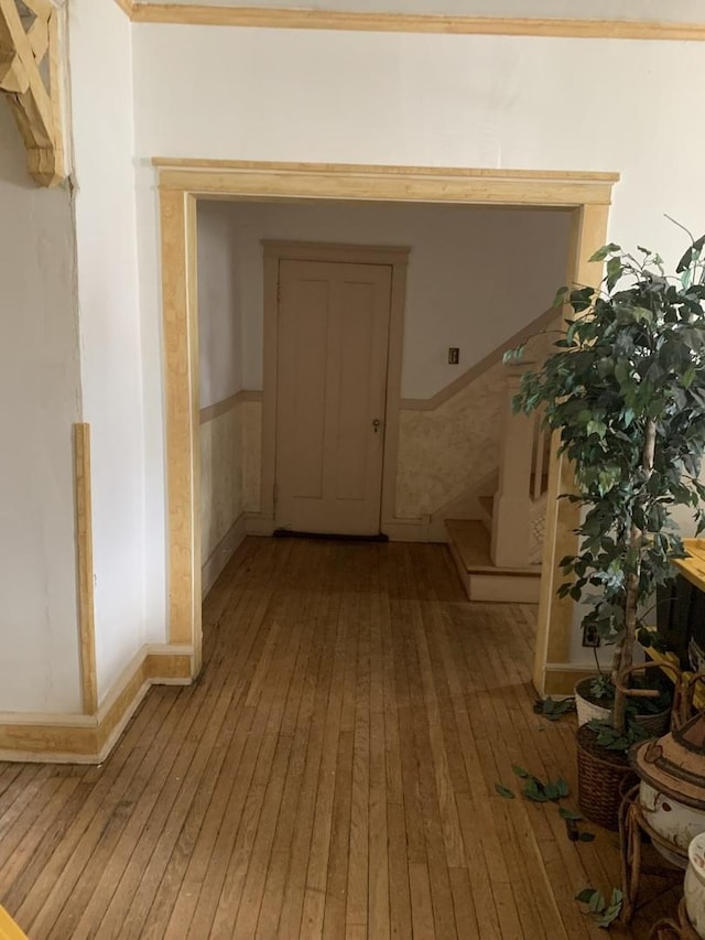 hall with stairs and light wood-type flooring