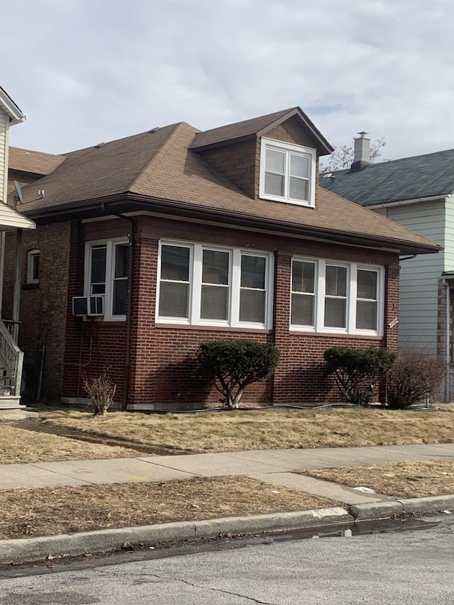 view of home's exterior featuring brick siding