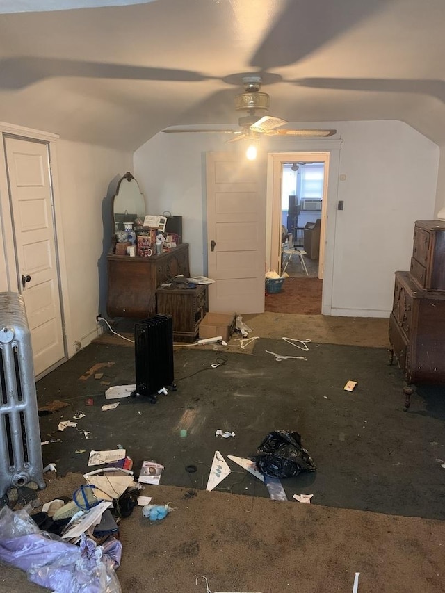 interior space featuring vaulted ceiling and ceiling fan