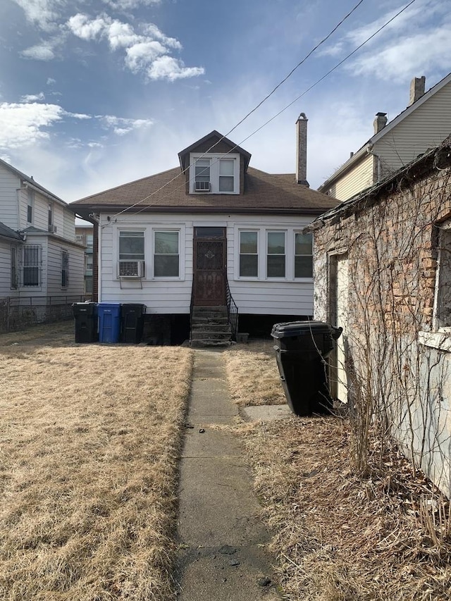 view of front of home featuring entry steps and cooling unit