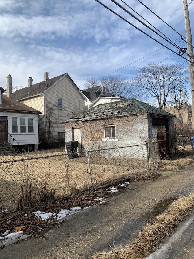 view of side of property with fence