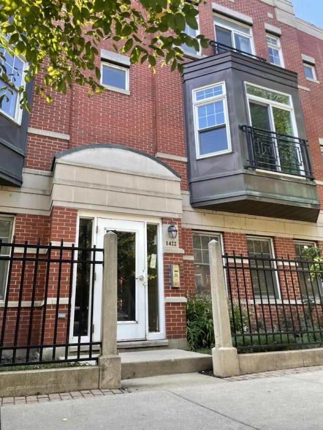 view of front of house featuring brick siding