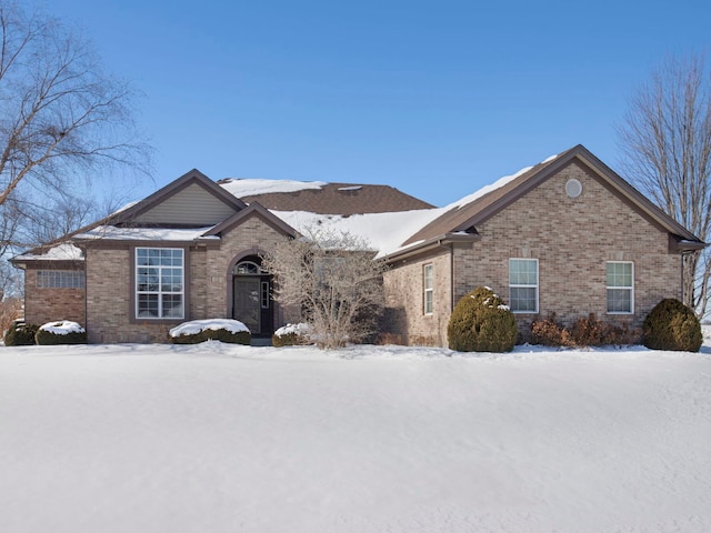 ranch-style house with brick siding