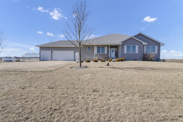 ranch-style home with a garage and driveway