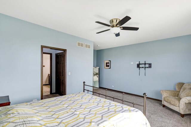 bedroom with light carpet, baseboards, visible vents, and ceiling fan