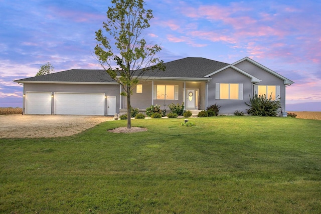 ranch-style house with a garage, dirt driveway, and a front lawn