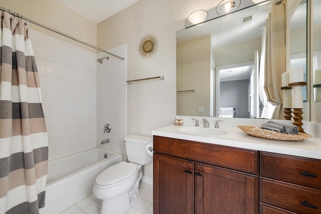 bathroom featuring visible vents, toilet, tile patterned floors, shower / bath combo with shower curtain, and vanity