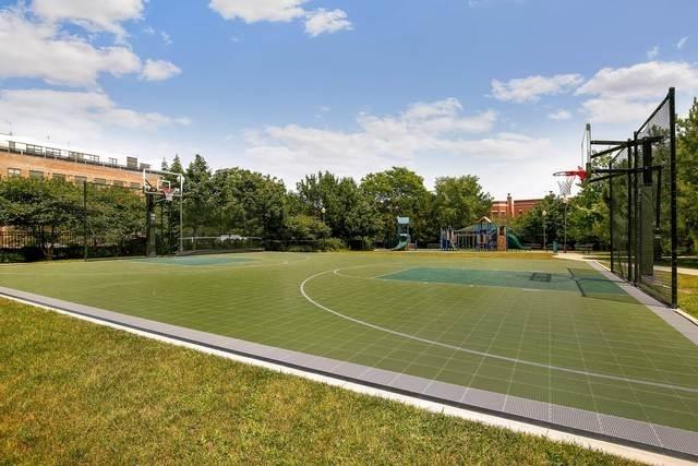 view of sport court with community basketball court and playground community