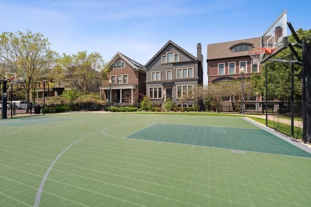 view of sport court featuring community basketball court and fence