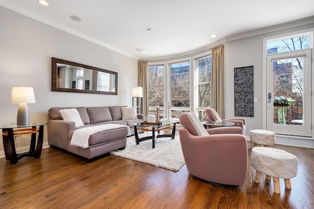 living area featuring baseboards, ornamental molding, dark wood finished floors, and recessed lighting