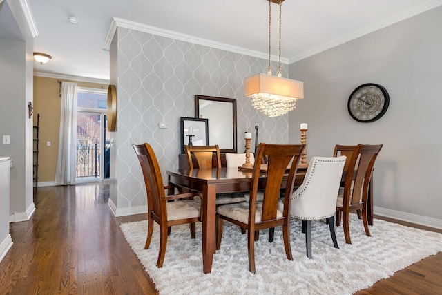 dining space featuring wallpapered walls, ornamental molding, wood finished floors, and baseboards