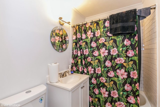 bathroom featuring ornamental molding, shower / bath combo, vanity, and toilet