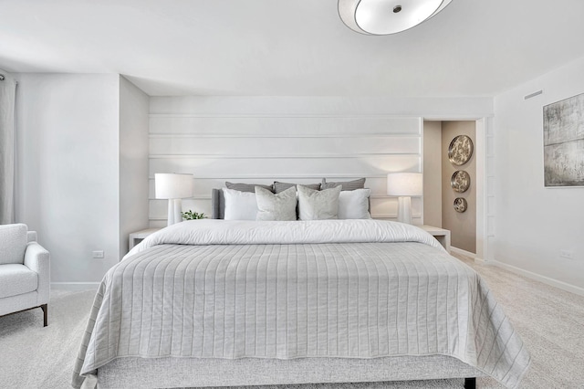 bedroom featuring carpet and baseboards