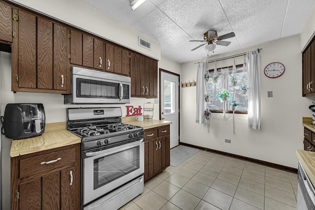 kitchen with stainless steel appliances, light countertops, and visible vents