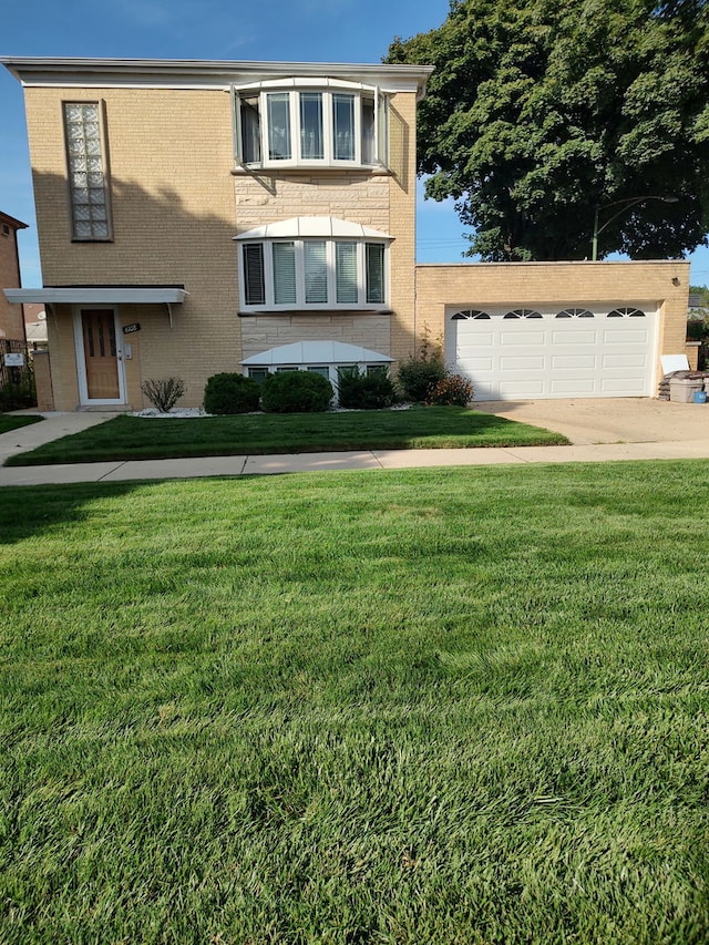 view of front of property with brick siding, driveway, and a front lawn