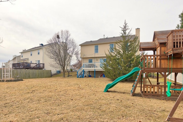 view of jungle gym featuring a yard and fence