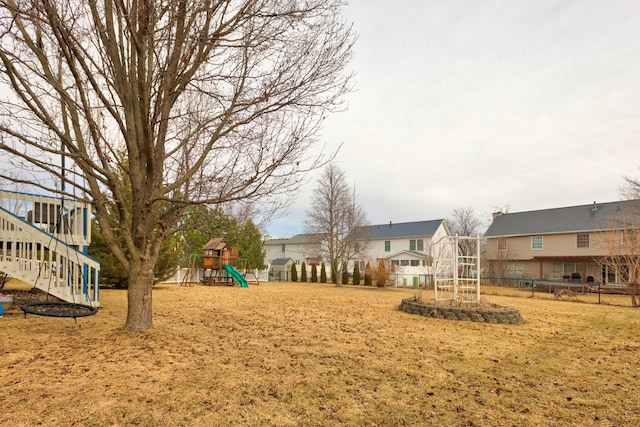 view of community featuring a playground and a residential view