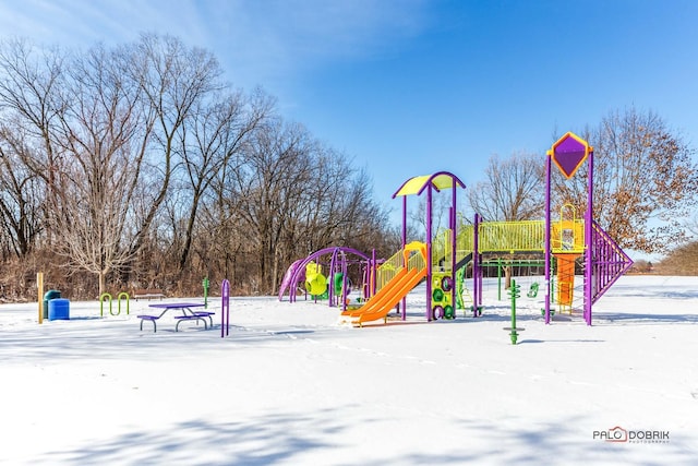 snow covered playground featuring playground community