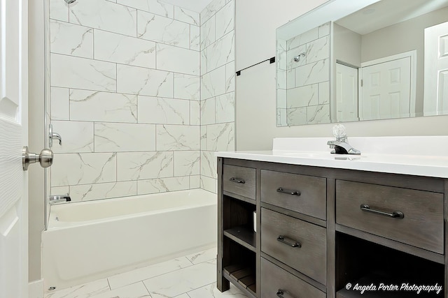 bathroom featuring marble finish floor, shower / washtub combination, and vanity