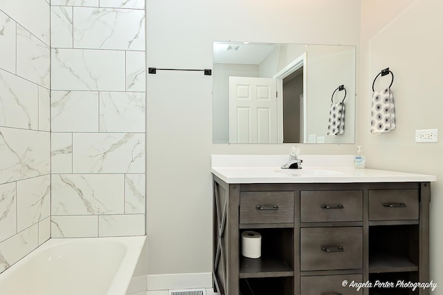 bathroom with baseboards and vanity