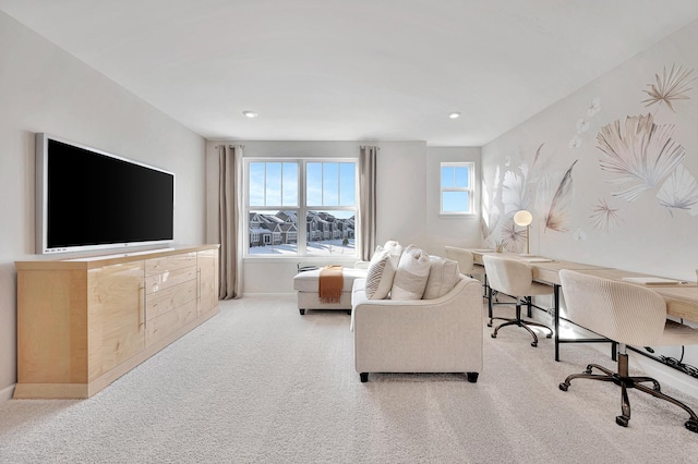 living area with light carpet, baseboards, visible vents, and recessed lighting