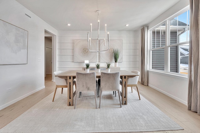 dining room with a chandelier, light wood-type flooring, baseboards, and recessed lighting