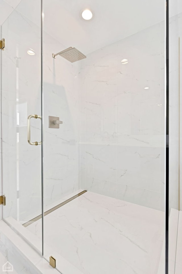 full bathroom with recessed lighting and a marble finish shower