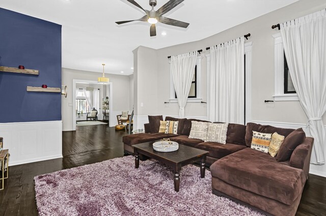 living room featuring ceiling fan, dark wood-type flooring, wainscoting, and recessed lighting