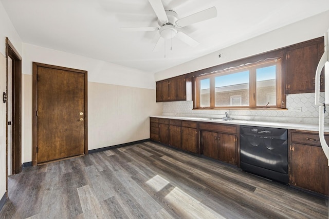 kitchen featuring dark wood-style floors, light countertops, dishwasher, and dark brown cabinetry