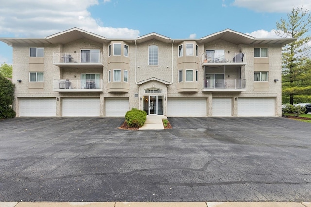 943 Elderberry Cir Unit 303, Naperville, IL 60563 - townhome / multi-family property featuring a garage and driveway