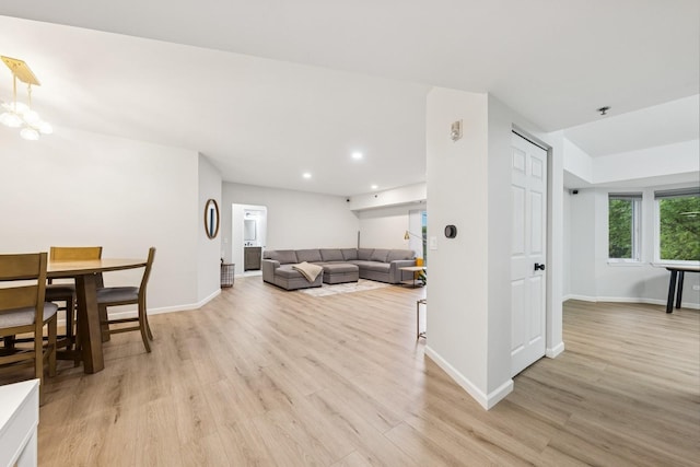 943 Elderberry Cir Unit 303, Naperville, IL 60563 - living room with recessed lighting, light wood-style floors, baseboards, and a chandelier