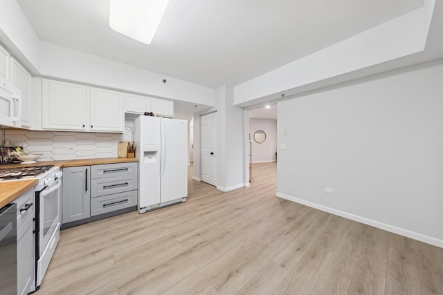 943 Elderberry Cir Unit 303, Naperville, IL 60563 - kitchen featuring butcher block counters, white appliances, decorative backsplash, white cabinetry, and light wood-style flooring
