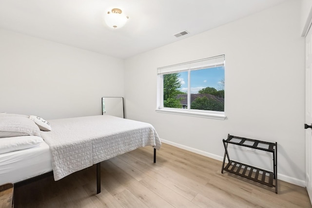 943 Elderberry Cir Unit 303, Naperville, IL 60563 - bedroom with baseboards and light wood finished floors