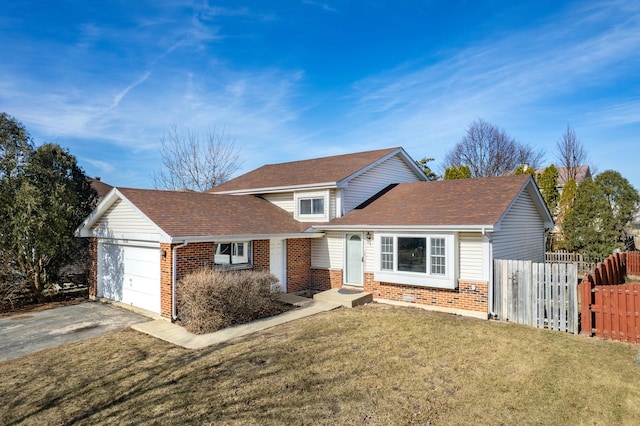 traditional home with brick siding, fence, a garage, driveway, and a front lawn