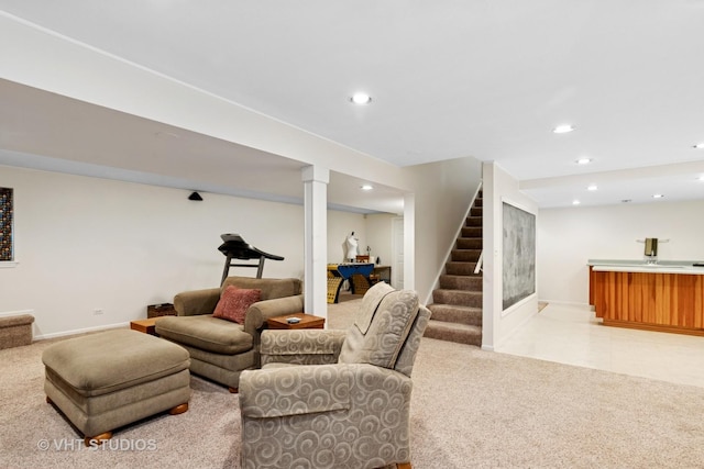 living area featuring recessed lighting, baseboards, light colored carpet, stairway, and light tile patterned flooring